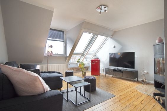 Unique! Charming, individual attic storey apartment with fireplace, wooden floorboards, exposed brickwork and view of the mining museum